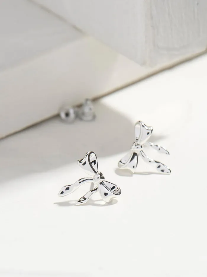 Women Jewellery Fat Face Silver Tone Bow Earrings